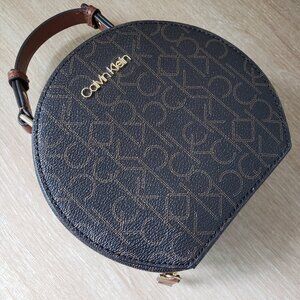 Calvin Klein Dark Brown Monogram Round Crossbody with Tan Handle